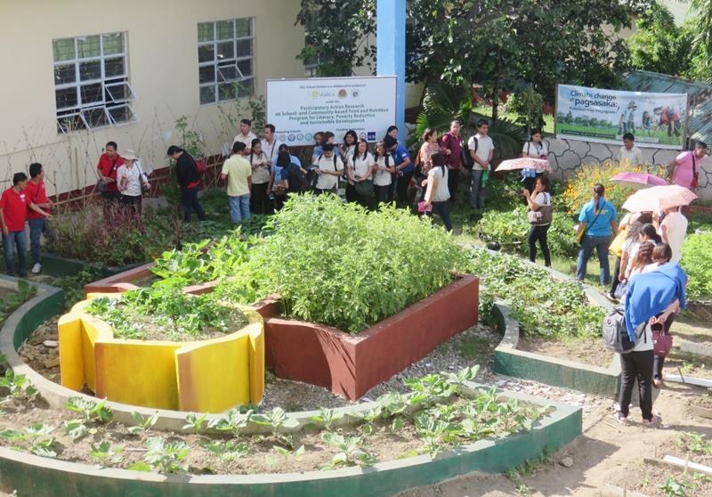 Participants touring the SEARCA-DepEd-UPLB School Garden of Pedro Guevara Memorial National High School
