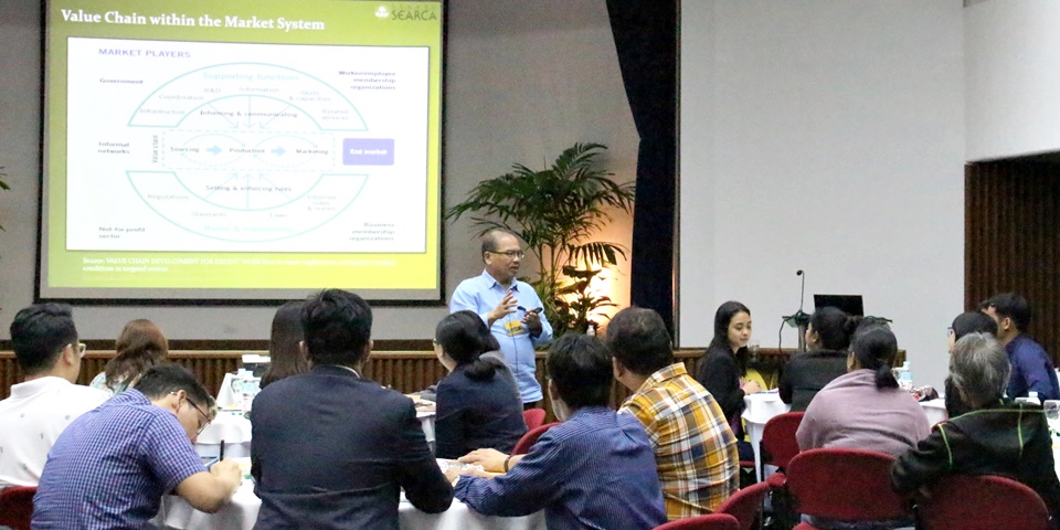 Prof. Wilfredo B. Carada, course Technical Coordinator, explains value chains within market systems