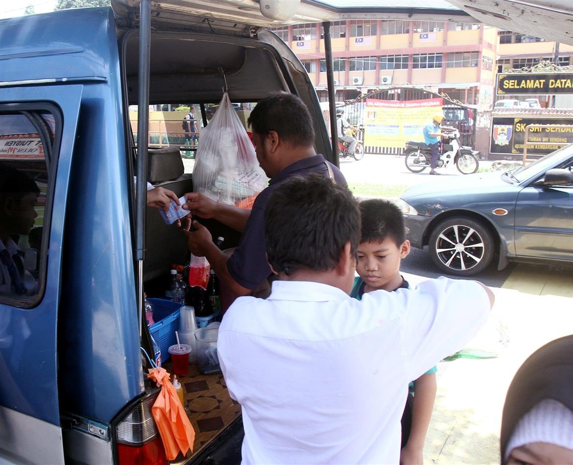 While the national policy is to restrict the promotion of unhealthy foods in childrens settings, street vendors selling junk food and sugary drinks outside schools are not uncommon, as seen in this filepic. 
