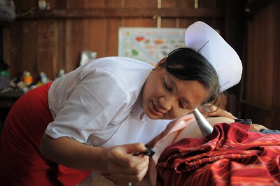A midwife provides a regular health check for a pregnant woman in Tone Le Village, Tone Le Sub Centre, Nyaung Shwe Township, Shan State, Myanmar.