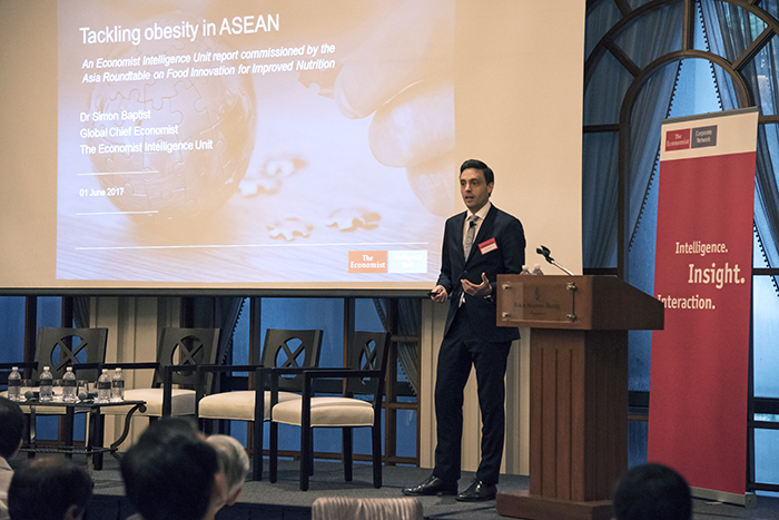 Dr Simon Baptist, the Economist Intelligence Unit's (EIU) Global Chief Economist and Managing Director of the organisation's Asia consultancy arm, presents report findings during a launch event in Singapore on 1 June.