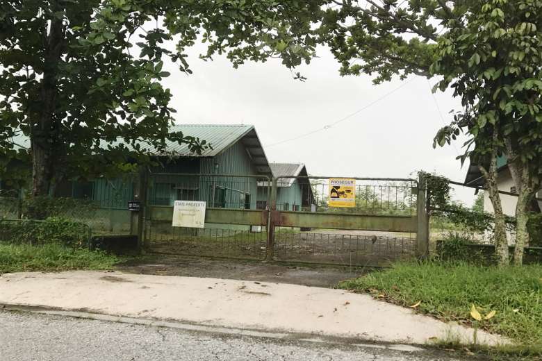 An SLA signboard hanging on the gates of a farm in Lim Chu Kang, stating that the land is now state property. The farm's licence was terminated in July 2015 for unauthorised earthworks.ST PHOTO: AUDREY TAN