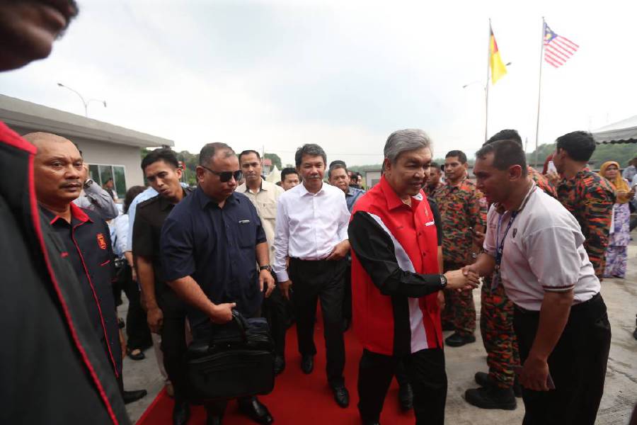 Deputy Prime Minister Datuk Seri Dr Ahmad Zahid Hamidi (second from right) arriving at the HyFresh factory in Pedas, Negri Sembilan. Pix by Hazreen Mohamad