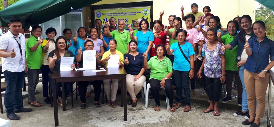 Members of Bohol Dairy Cooperative pose for a souvenir photo as they receive the equipment, tools, and supplies for The Dairy Box – Bohol on 15 February 2018 at Tamboan, Carmen, Bohol